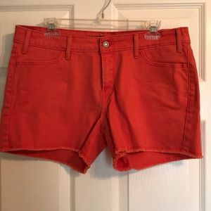 Orange Levi’s cutoff style shorts size women’s 14